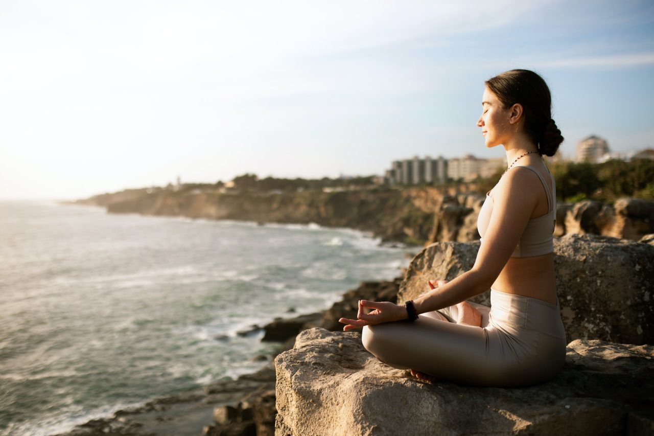 glad-calm-slim-millennial-european-female-in-sportswear-practicing-yoga-enjoy-training-meditating.jpg